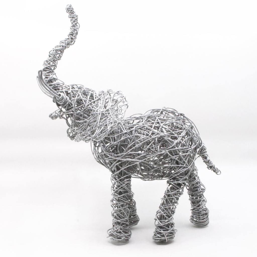 side view of hand twisted galvanized wire art elephant with trunk up