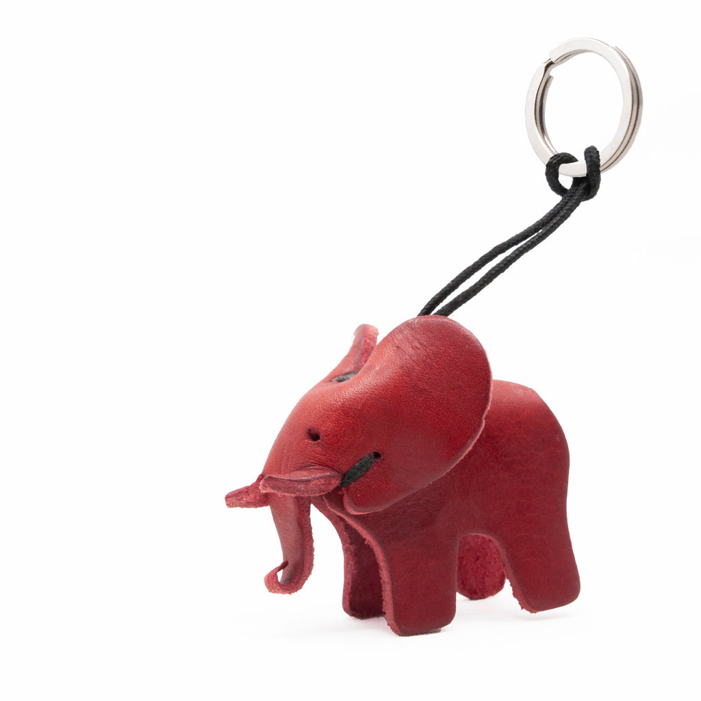 artisan crafted hand stitched baby elephant keychain in red coloured  leather. 