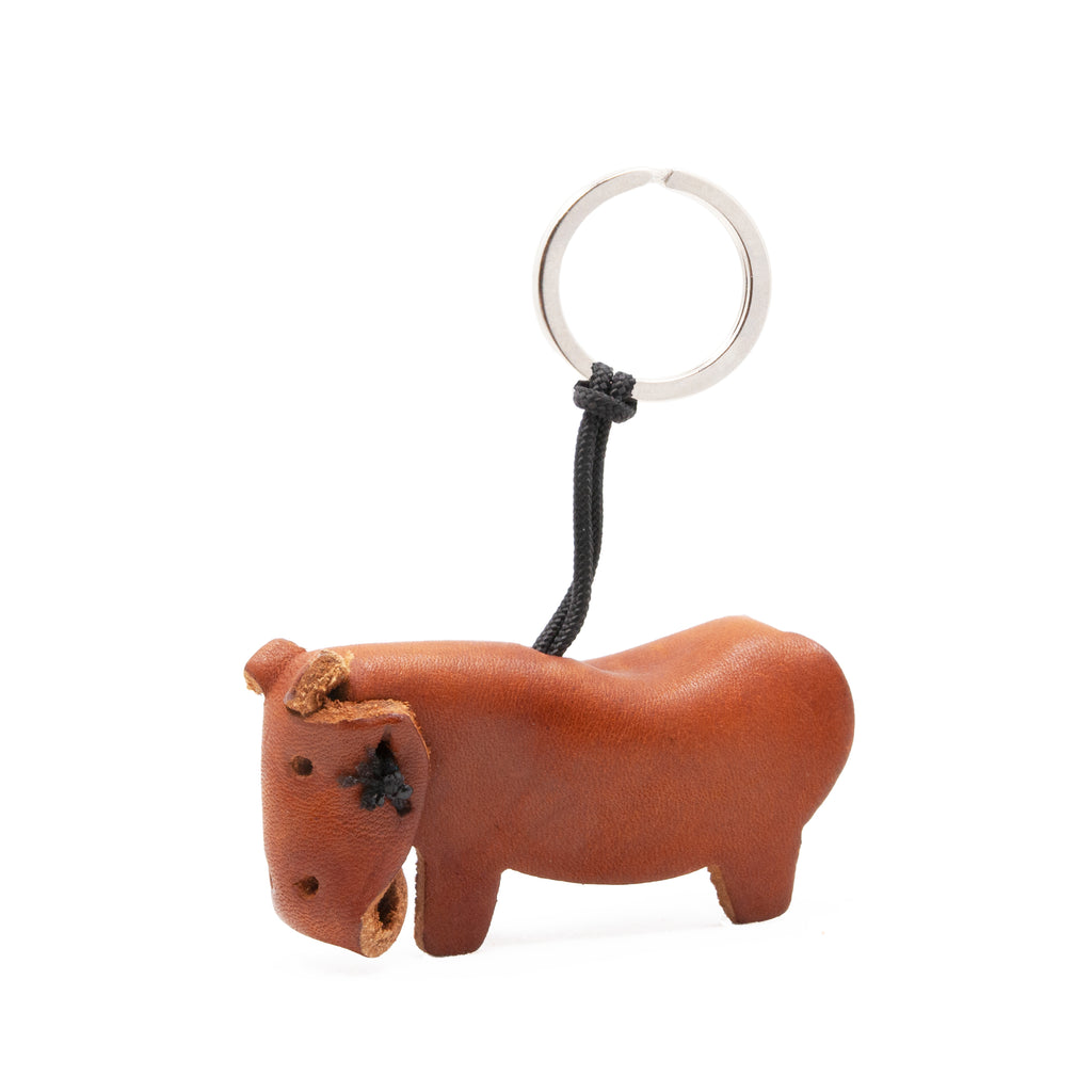 artisan crafted hand stitched hippo keychain in tan coloured  leather. 