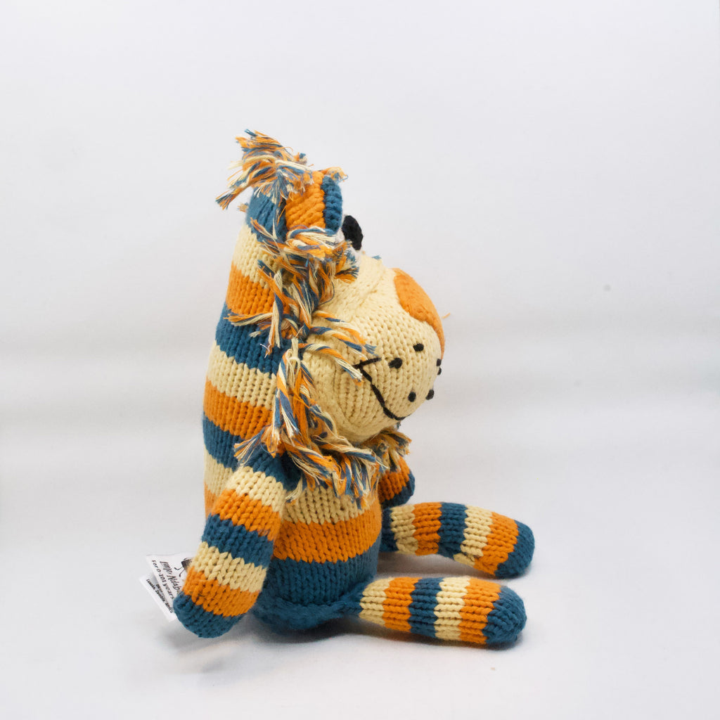 side view of artisan knit stuffed lion toy