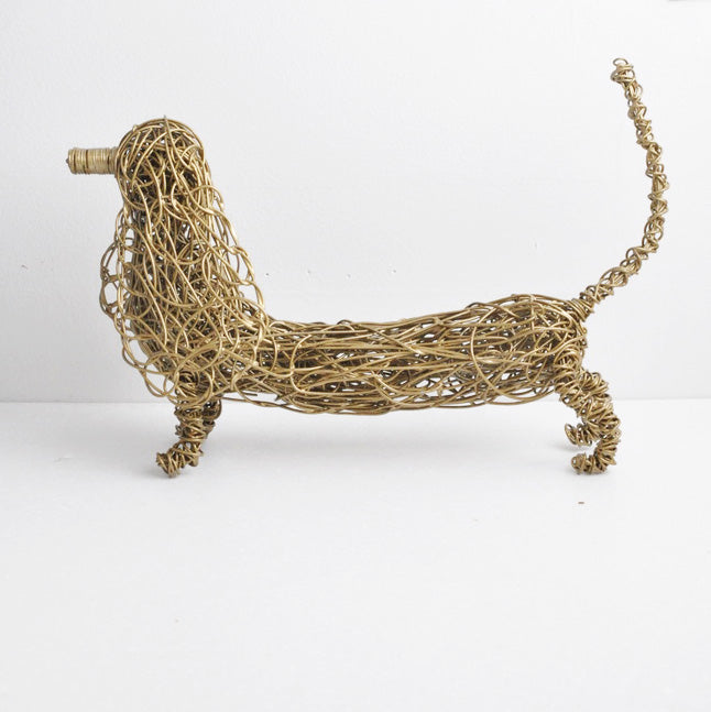 hand twisted galvanized wire art dachshund powder coated gold. side view
