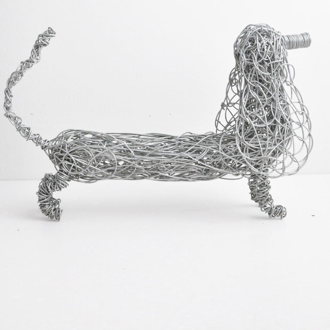 side view of hand twisted gavanized wire dachshund sculpture