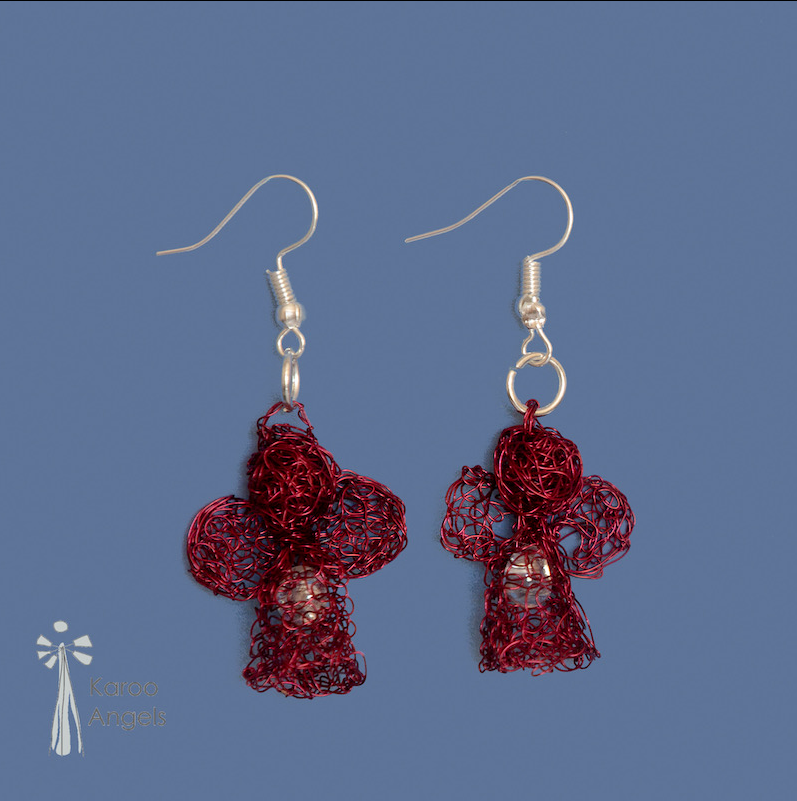 Tiny and delicate Karoo Angels Juweel Earrings. Made of knit scarlet red coloured coated copper wire adorned with a small preciosia crystal bead shining out from within the bodice of the angel 
