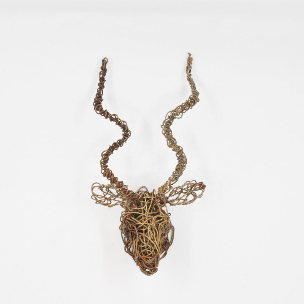 mini kudu head wall art of rusted galvanized wire. Wire is twisted and manipulated entirely by hand