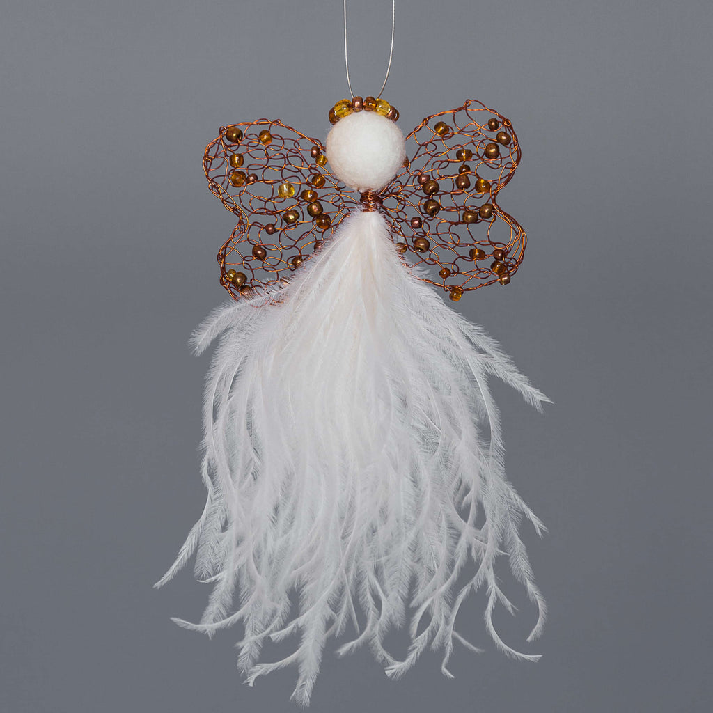 Karoo Angel. Edwina meaning vaulable friend.  Knit double heart shape copper wire wing with copper beads, a felted wool head with a copper beaded halo and cream coloured ostrich feather 'skirt'