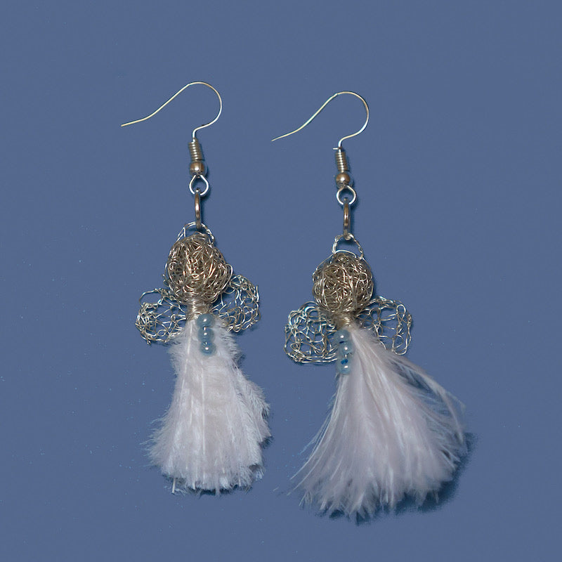 Tiny and delicate Karoo Angels Juweel Earrings. Made of knit silver coloured coated copper wire adorned with a small preciosia crystal bead and a white ostrich feather bodice