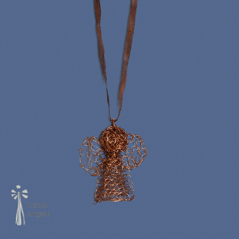 Tiny and delicate Karoo Angels Juweel Angel Pendant. Made of knit amber coloured coated copper wire inset with small preciosia crystal bead. comes with silk tie matching the colour of the wire. Size is 2.5 cm tall