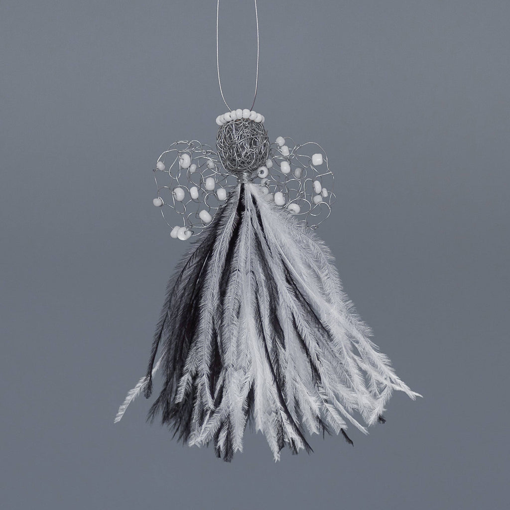 delicate angel decoration with a mixed white and black feather bodice, wire wings with white beads and a wire head with a white beaded halo