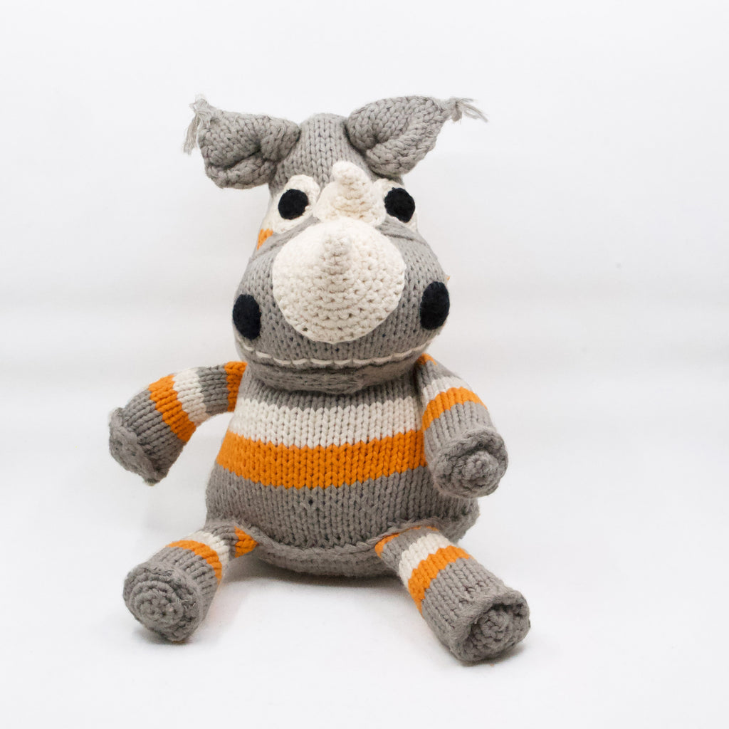 adorable artisan knit rhino in orange, white and grey stripes