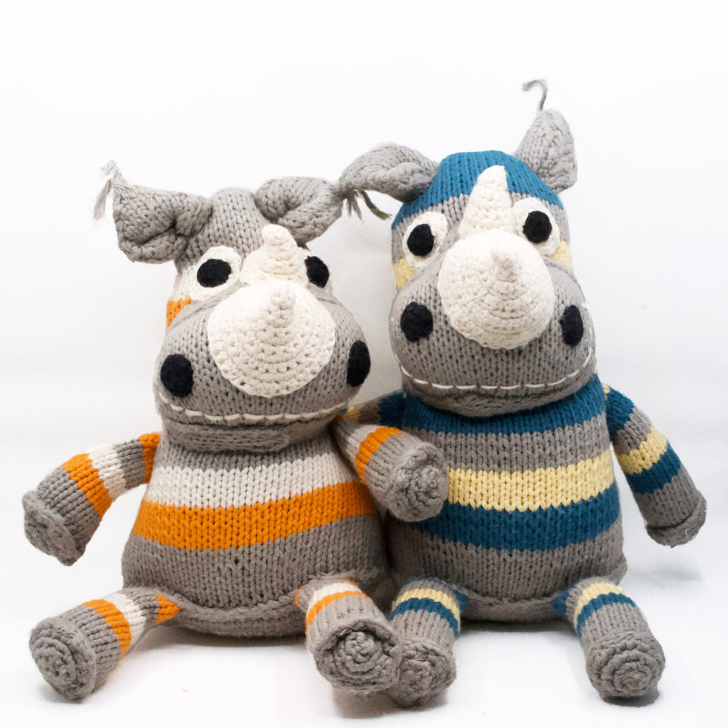 cute artisan knit rhino stuffies sitting side by side
