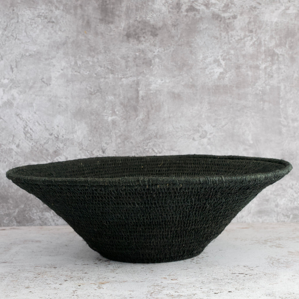 large hand woven sisal basket in black shown from the side