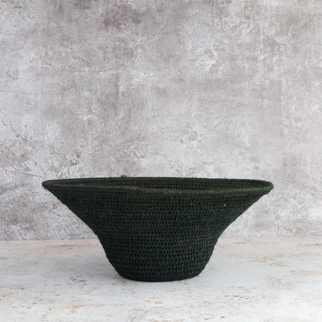 side view of medium size hand woven sisal basket in black