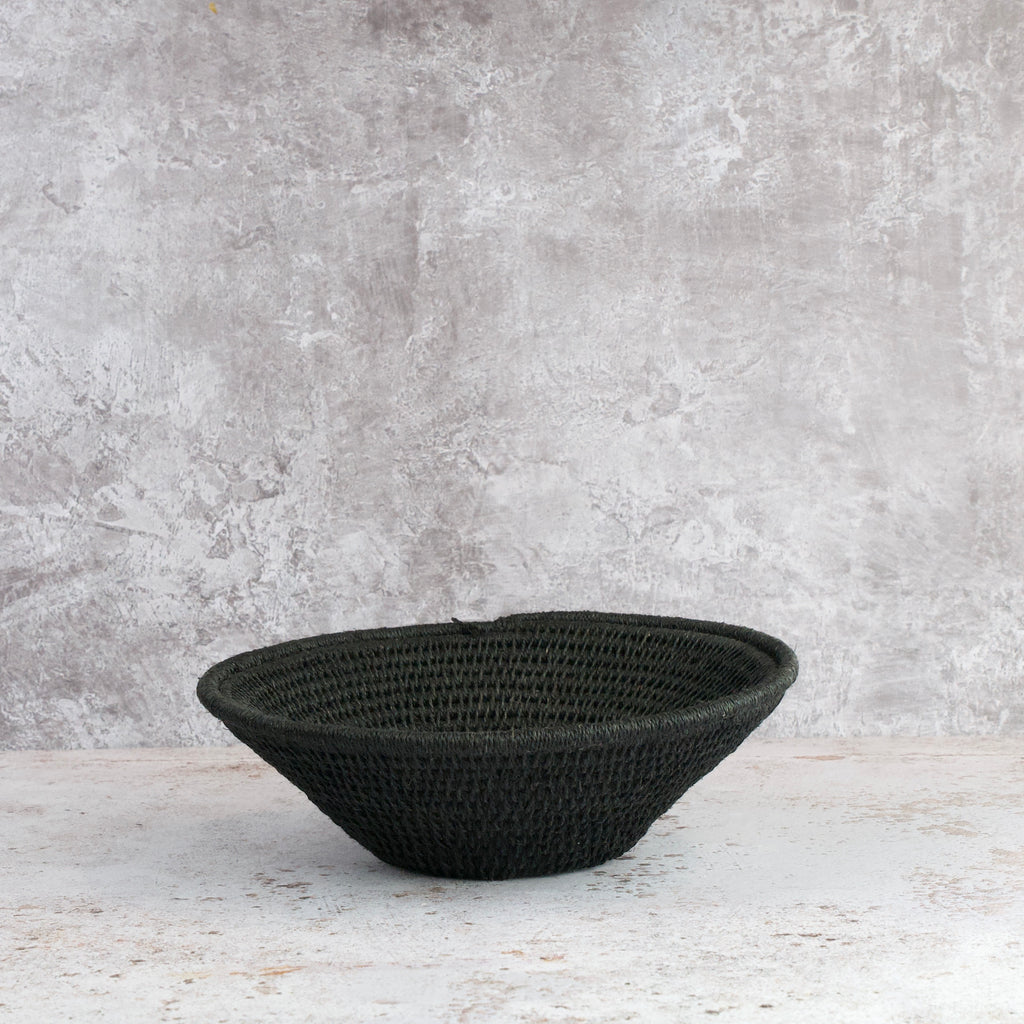 side view of small size hand woven sisal basket in black