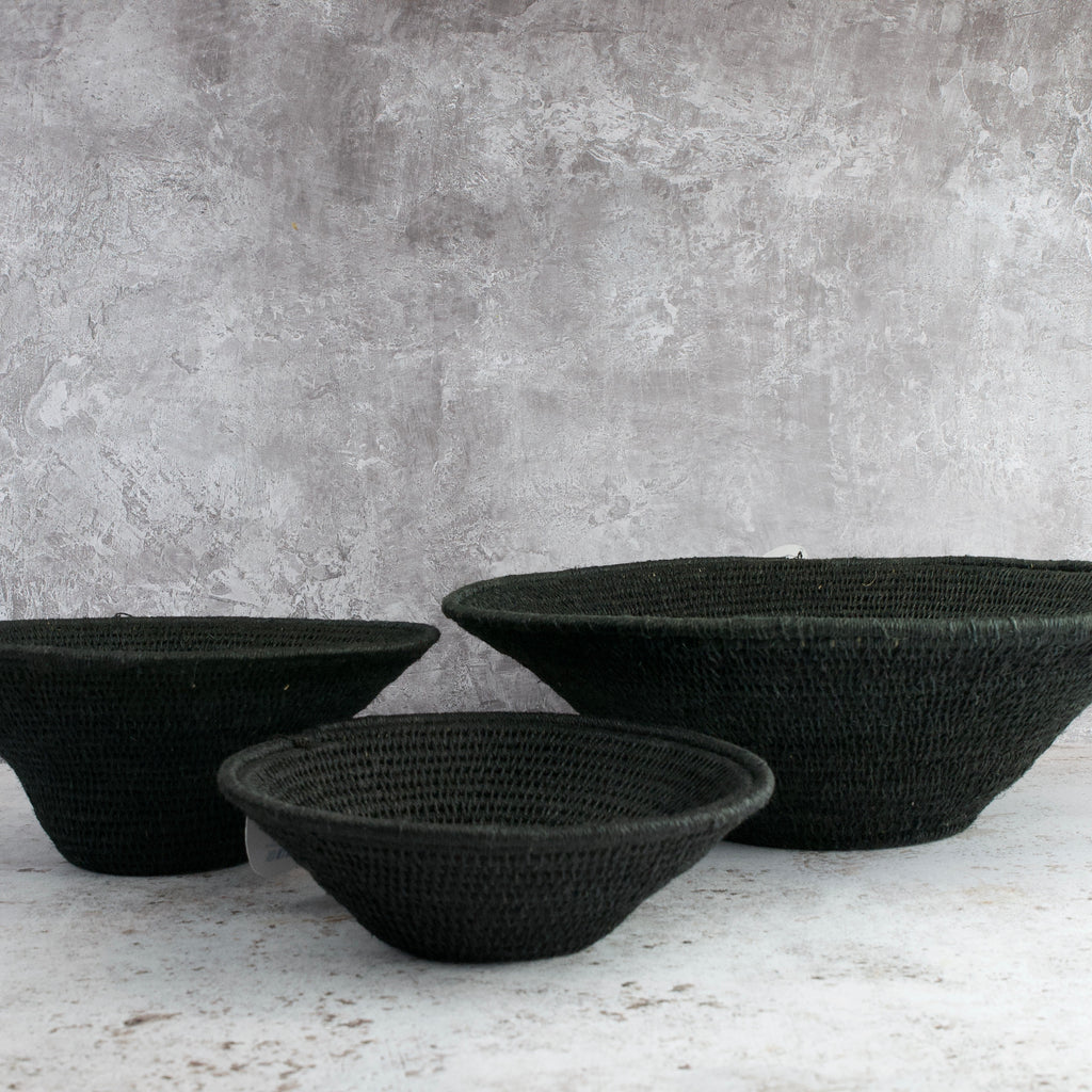 grouping of three hand woven sisal baskets in various sizes of black